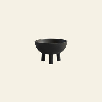 The 101 Copenhagen Duck Bowl, Big is a black ceramic bowl with legs, featuring Scandinavian-inspired aesthetics.