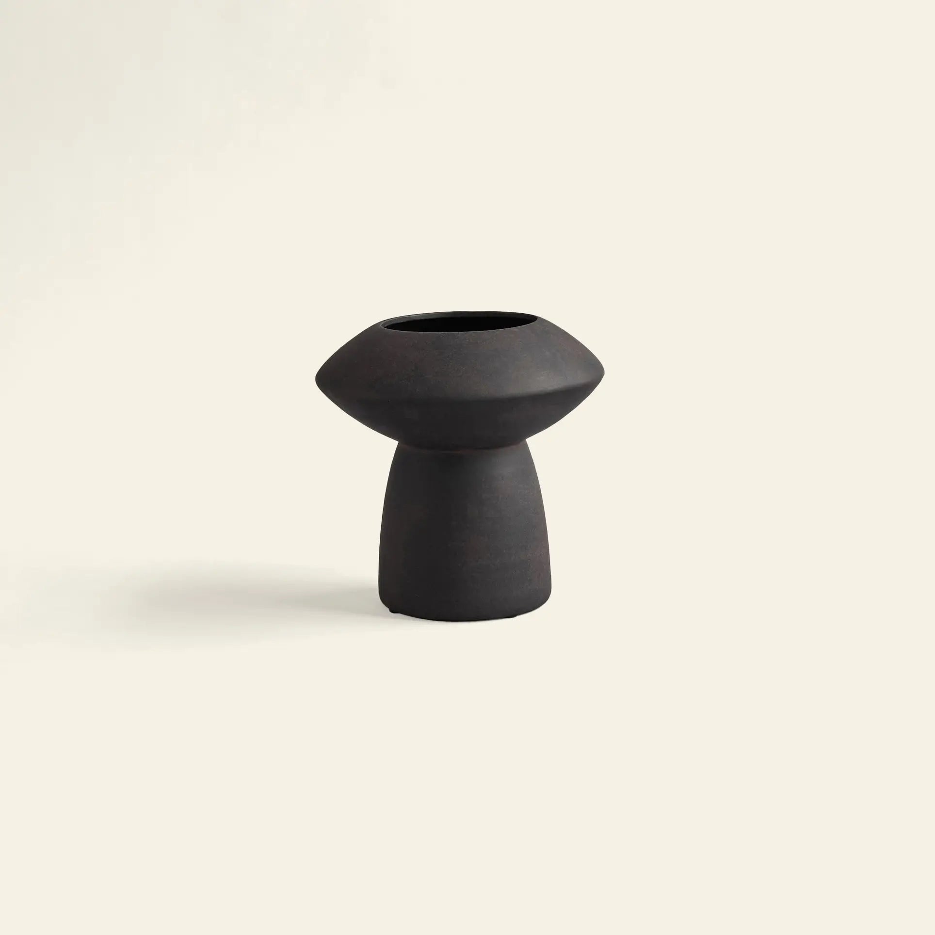 The 101 Copenhagen Sphere Vase Fat by 101 Copenhagen features a wide, rounded top and narrow base. Its smooth matte finish and modern minimalist design create a timeless centerpiece for any space, displayed here on a plain light background.
