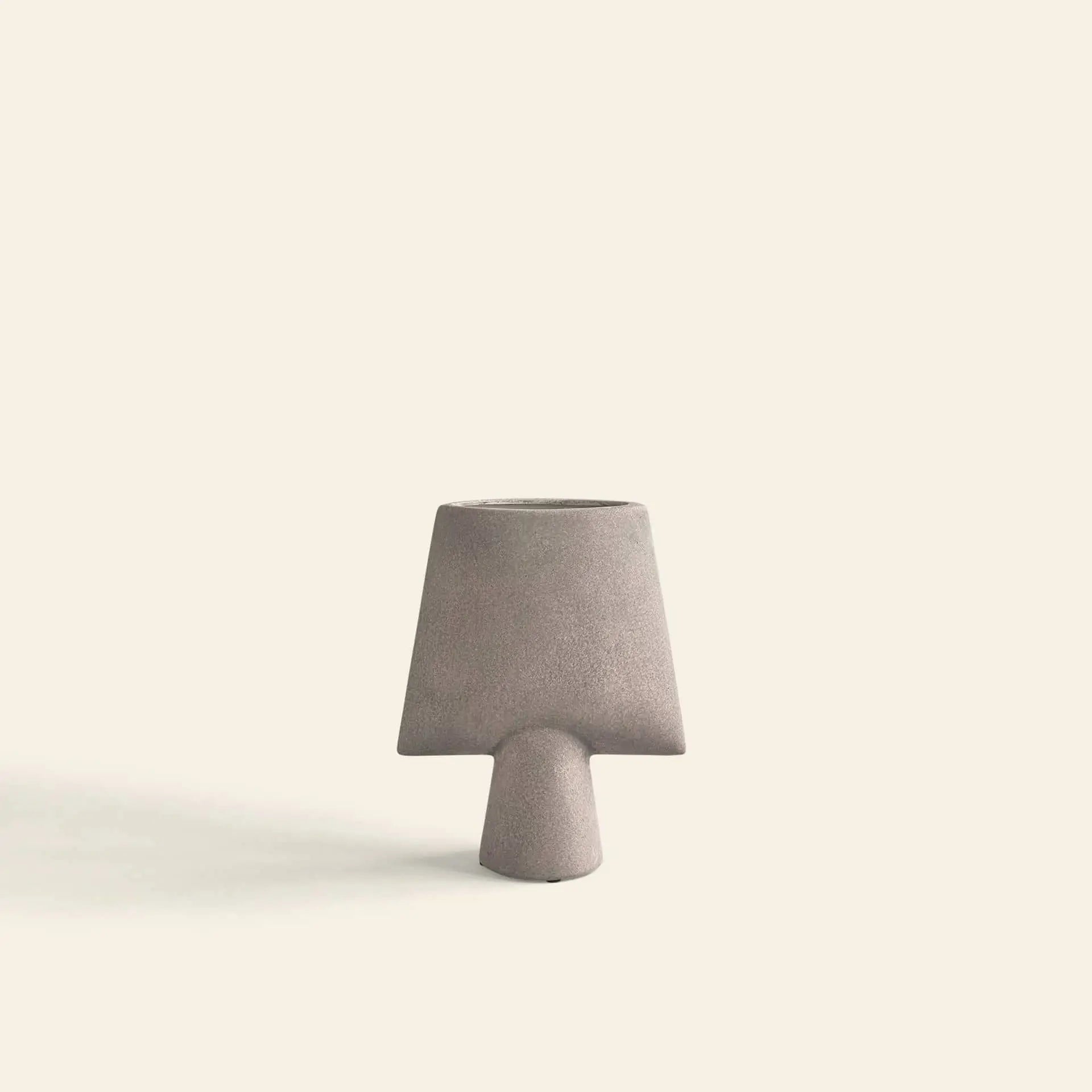 The 101 Copenhagen Sphere Vase Square, Mini features a minimalist matte gray finish with a wide angular top and narrow base—ideal for modern home décor. Brand: 101 Copenhagen. Set against a plain off-white background.
