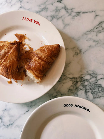 Serve breakfast in bed with the Anna + Nina I Love You Breakfast Plate, featuring “I LOVE YOU.” on the rim—a charming piece from Anna + Nina to start your morning with love.
