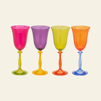 The Anna + Nina Multicoloured Wine Glasses, Set of 4, feature vibrant bowls and matching or contrasting stems in a vintage design—perfect as a housewarming gift.