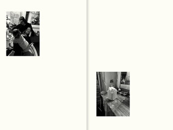 Two black-and-white photos on facing pages: left, two people at a table with papers; right, art supplies and a sculpture, evoking the creative vibe of Copenhagen restaurants in Apartamentos All The Stuff We Cooked: 49 Recipes.