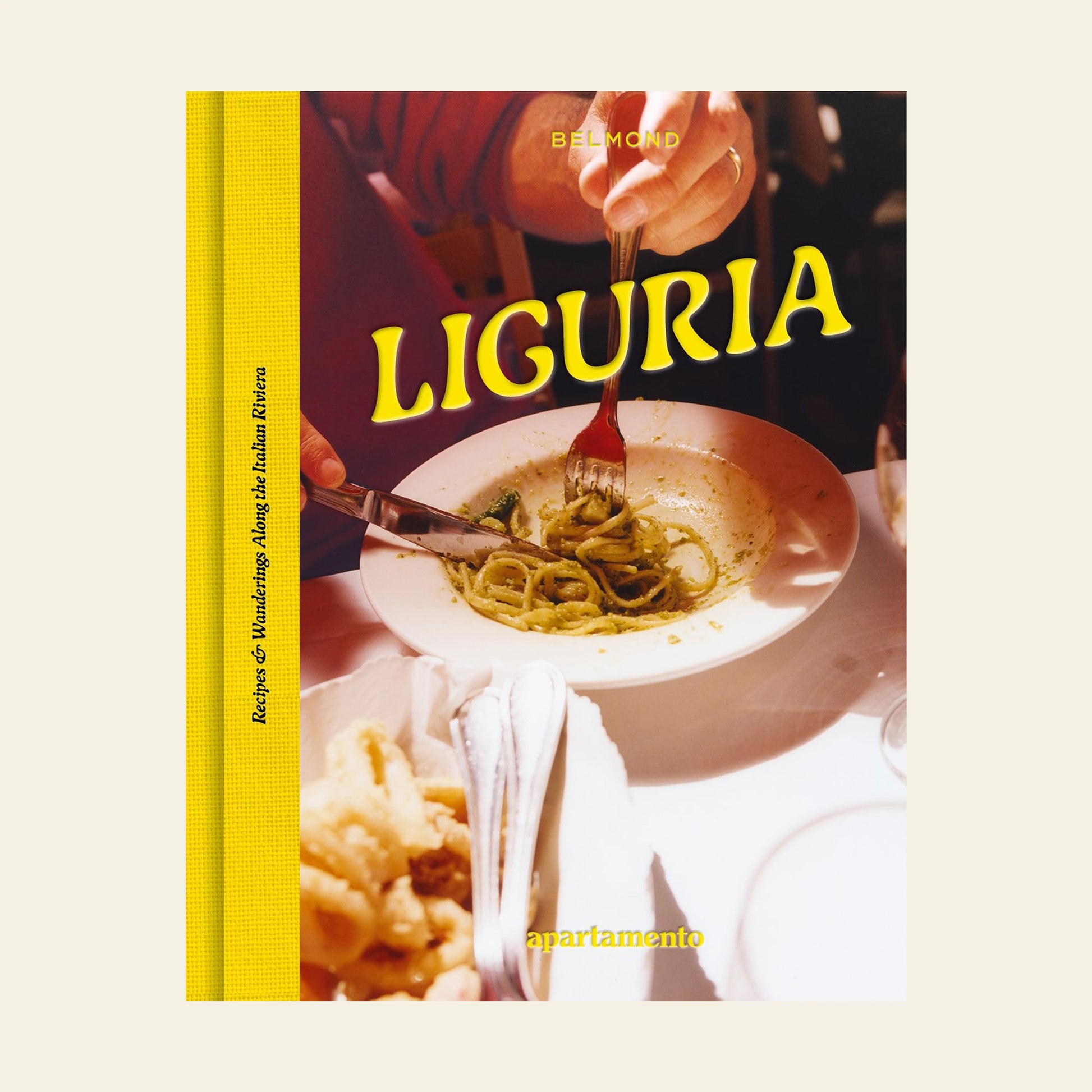 Apartamento LIGURIA: Recipes & Wanderings Along the Italian Riviera by Apartamento features a close-up of twirled pasta above a white plate, evoking the flavors and communities of the Italian Riviera on a sunlit, food-laden table.