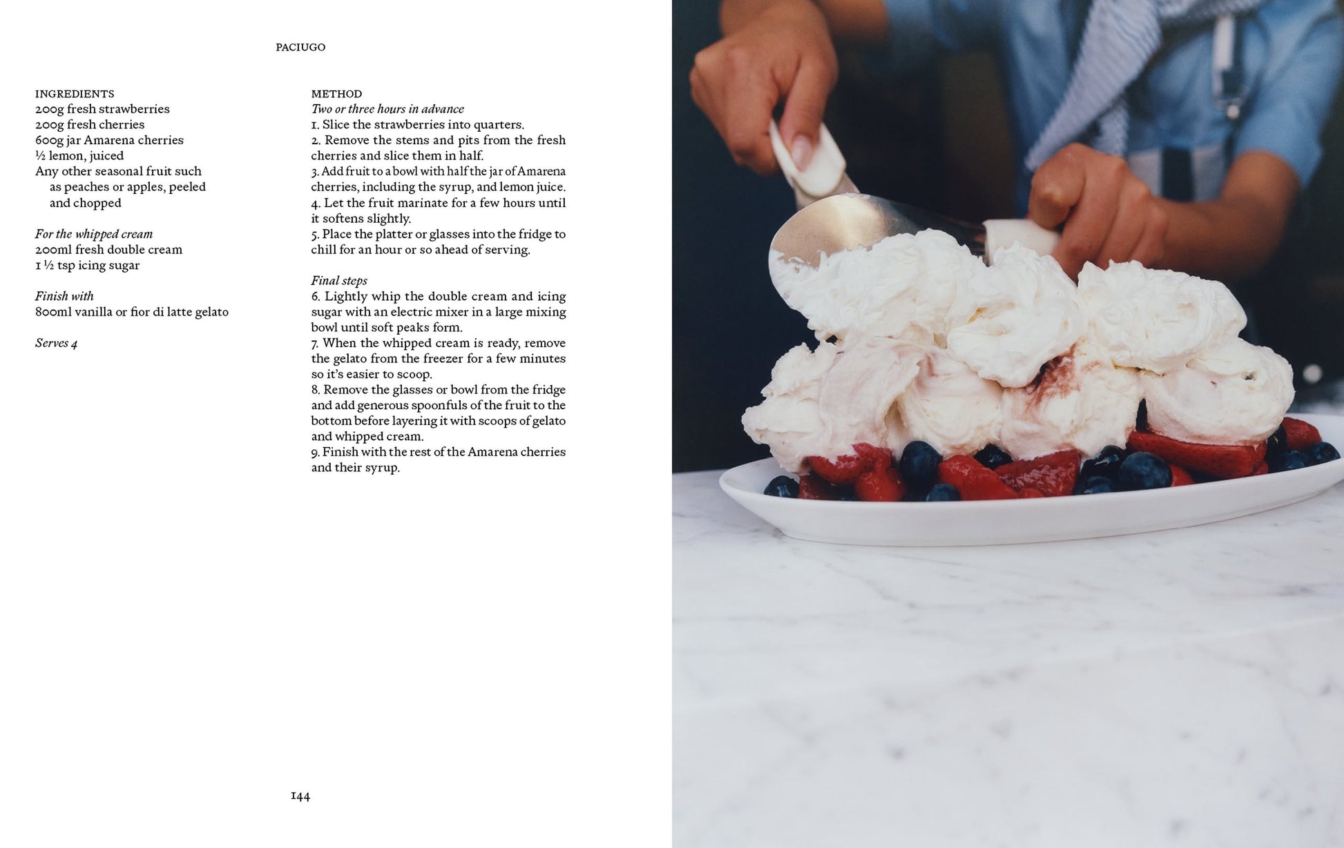 A person adds whipped cream to a plate of strawberries and blueberries. On the left lies Apartamento’s LIGURIA: Recipes & Wanderings Along the Italian Riviera, featuring regional recipes and culinary inspiration.