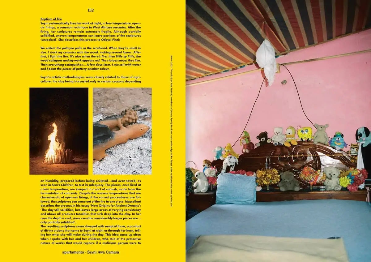 A cozy bedroom scene with blue bedding, pink walls, and playful décor is featured in Apartamento Magazine Issue #31 by Apartamento, with a page of text and a bonfire photo shown on the left.