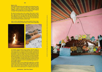 A cozy bedroom scene with blue bedding, pink walls, and playful décor is featured in Apartamento Magazine Issue #31 by Apartamento, with a page of text and a bonfire photo shown on the left.