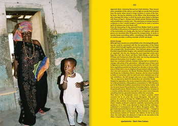An elderly woman in vibrant traditional attire stands by a child indoors near a faded blue and white wall, sunlight streaming in. Inspired by Apartamento Magazine Issue #31 from Apartamento, Spring Summer 2023.