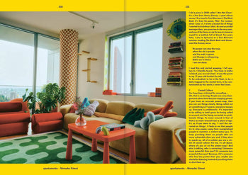 A colorful living room with a beige curved sofa, red armchairs, green patterned rug, and orange coffee table channels Autumn/Winter 2023-24 style. Apartamento Magazine Issue #32 by Apartamento lines floating shelves among vases and books.