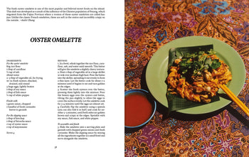 A plate of oyster omelette on banana leaf sits on a green dish with red dipping sauce, illustrating Penang cuisine. The left page features a recipe from Apartamento PENANG: Recipes & Wanderings Around an Island in Malaysia by Apartamento.