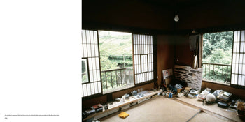 A tatami-mat Japanese room with bookshelves, shoji screens, and broad windows evokes the Tokyo Style aesthetic of Apartamento Tokyo Style by Kyoichi Tsuzuki. Art supplies lie beneath a single bulb, channeling the Apartamento vibe.