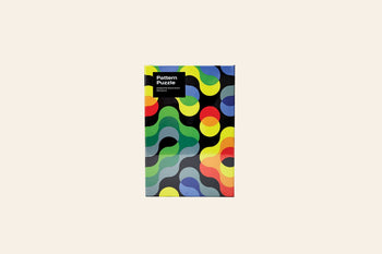 The Areaware Dusen Dusen - Pattern Puzzle by Areaware is a 500-piece jigsaw featuring a bold abstract design with wavy, interlocking shapes on a light beige background—ideal for design enthusiasts.
