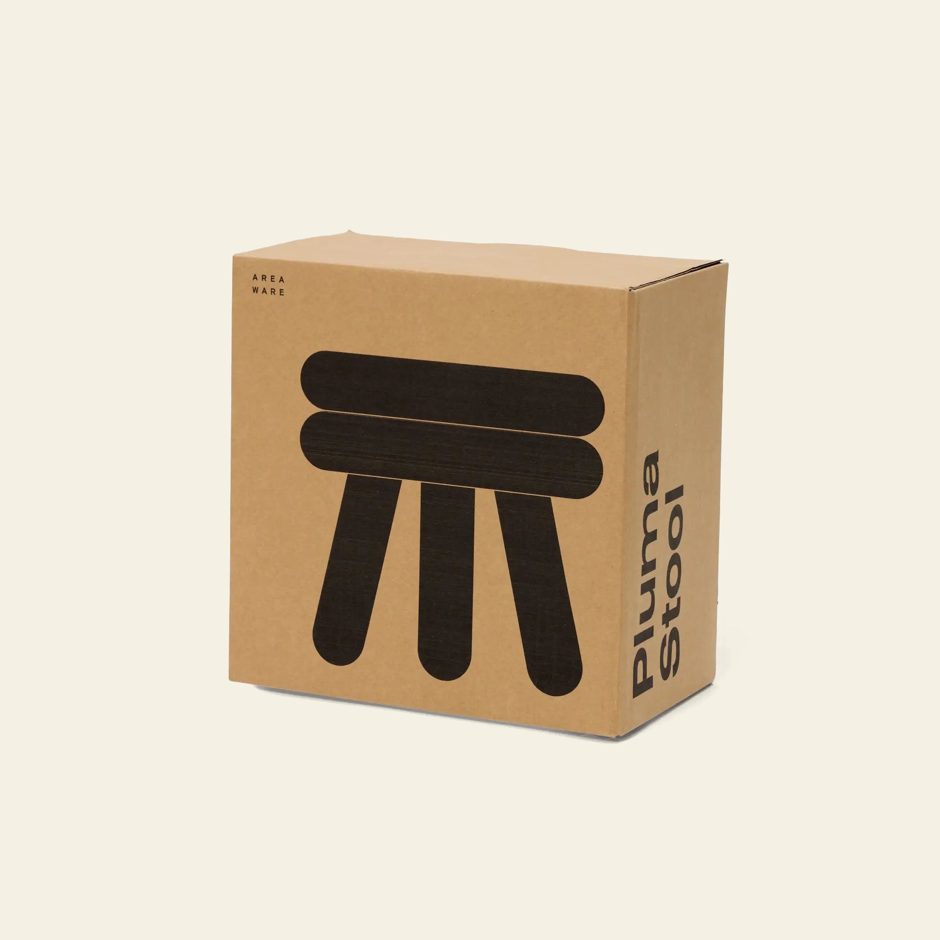 A cardboard box with Areaware Pluma Stool Short printed on the side and a simple black graphic of the three-legged contemporary stool on the front, set against a plain light background.