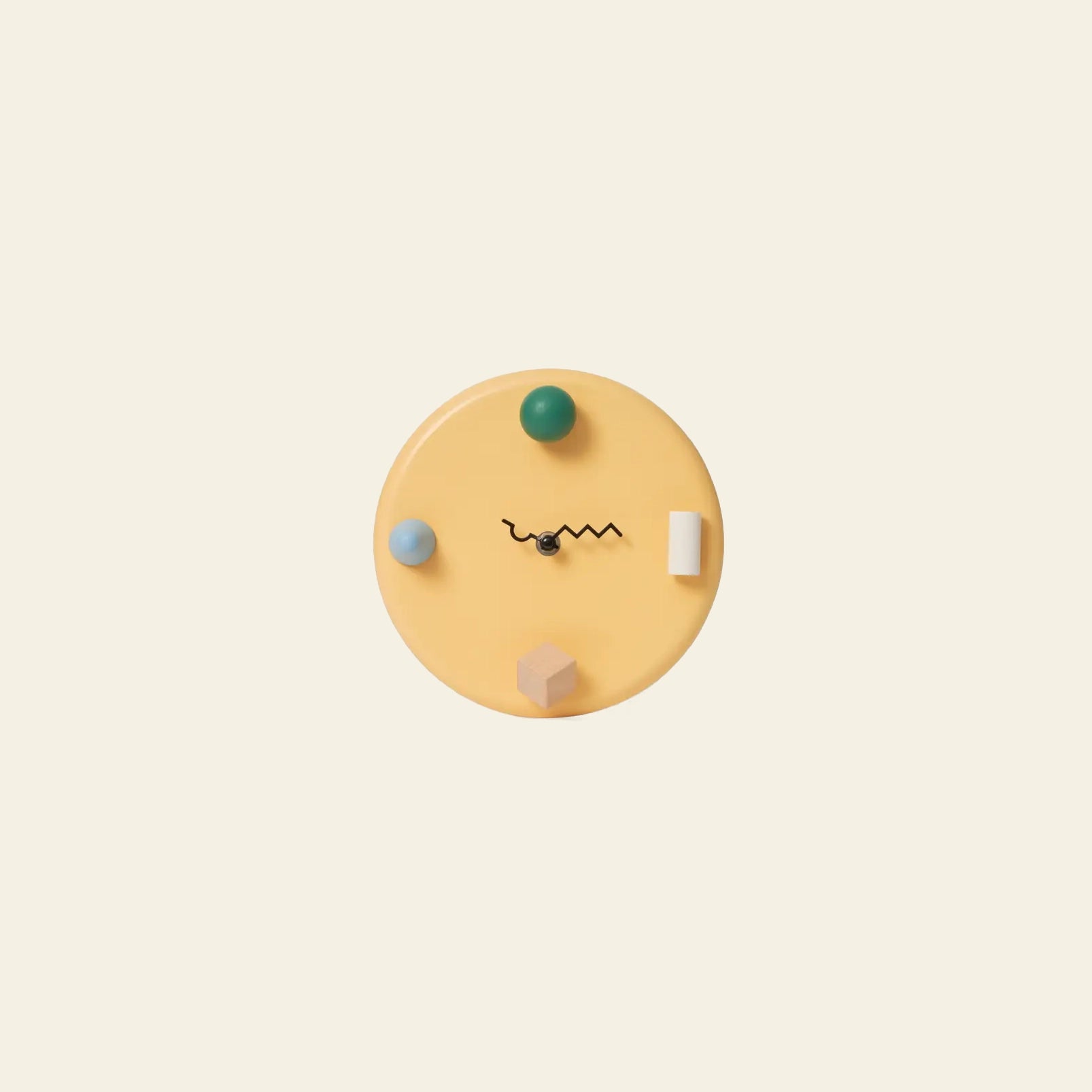 The Areaware Wall Clock by Areaware features a minimalist yellow design with geometric shapes, abstract hour markers, and wavy black hands, adding whimsical style to an off-white wall.