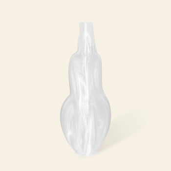 The Argot Studio Éson Vessel, Medium by Argot Studio is a translucent, curvy modern vase with a narrow neck and broad base, standing upright against a light beige background.