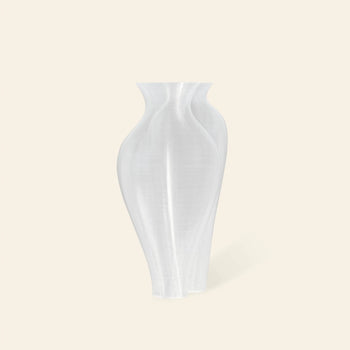 The Argot Studio Soeurs Vase by Argot Studio features a translucent white finish, smooth curves, and a modern hourglass design, displayed against a plain light beige background.