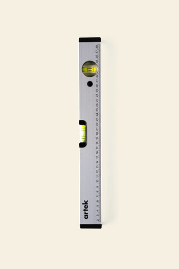 The Artek Level by Artek, an aluminum tool with a built-in ruler and two bubble vials for horizontal and vertical alignment, is displayed against a plain light background—perfect for precise results.