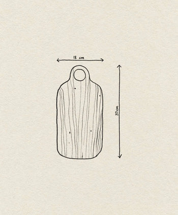 The Bloomingville Abbas Cutting Board by Bloomingville is a simple line drawing of a mahogany wood board with a handle and top hole, measuring 18 cm wide by 37 cm tall. Its illustrated wood grain texture makes it ideal for meal preparation.