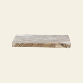 The Bloomingville Gabrielle Trivet by Bloomingville is a rectangular brown and beige marble trivet with smooth, slightly rounded edges—ideal for protecting your table. Displayed against a plain light background.