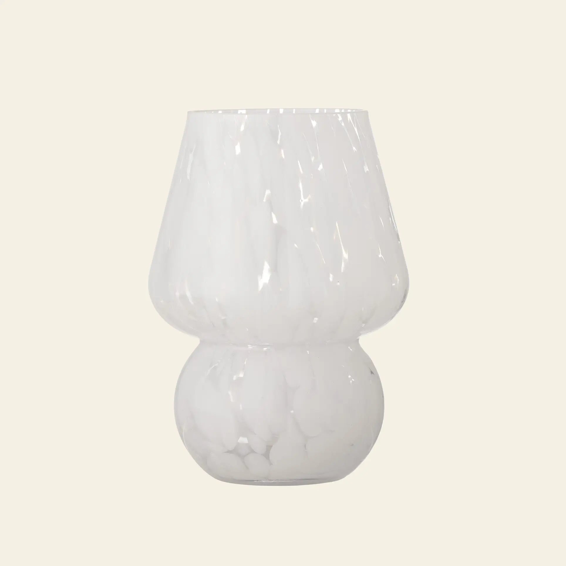 The Bloomingville Halim Vase by Bloomingville is a modern glass piece with a glossy marbled white finish, wide flared top, and rounded base, adding striking decorative appeal against a plain light background.