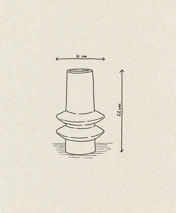 A line drawing of the Bloomingville Isold Vase by Bloomingville, with geometric shapes and measurements—12 cm wide, 22 cm tall—displayed on a textured beige background for a rustic look.