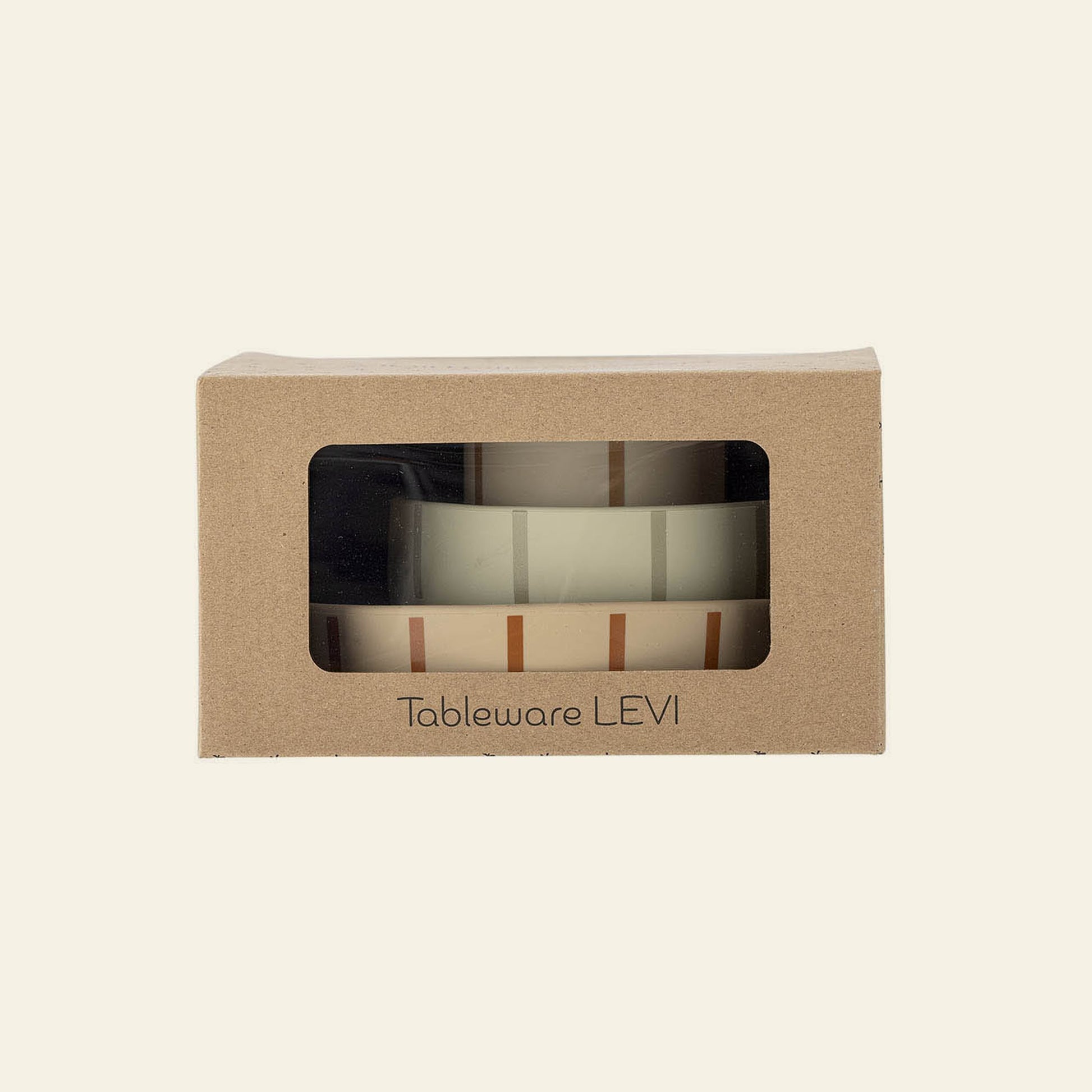 A cardboard box with a clear window displays the Bloomingville Levi Tableware Set—stacked ceramic pieces with a simple striped design—labeled “Bloomingville” on the front; a charming gift for young children.