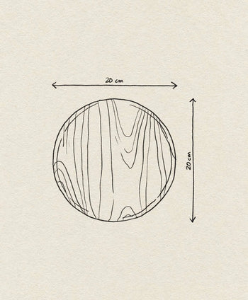 Hand-drawn illustration of the Bloomingville Nolia Plate, 20cm, by Bloomingville. Features rustic rubberwood with visible grain. Arrows and labels show 20 cm diameter above and to the right.