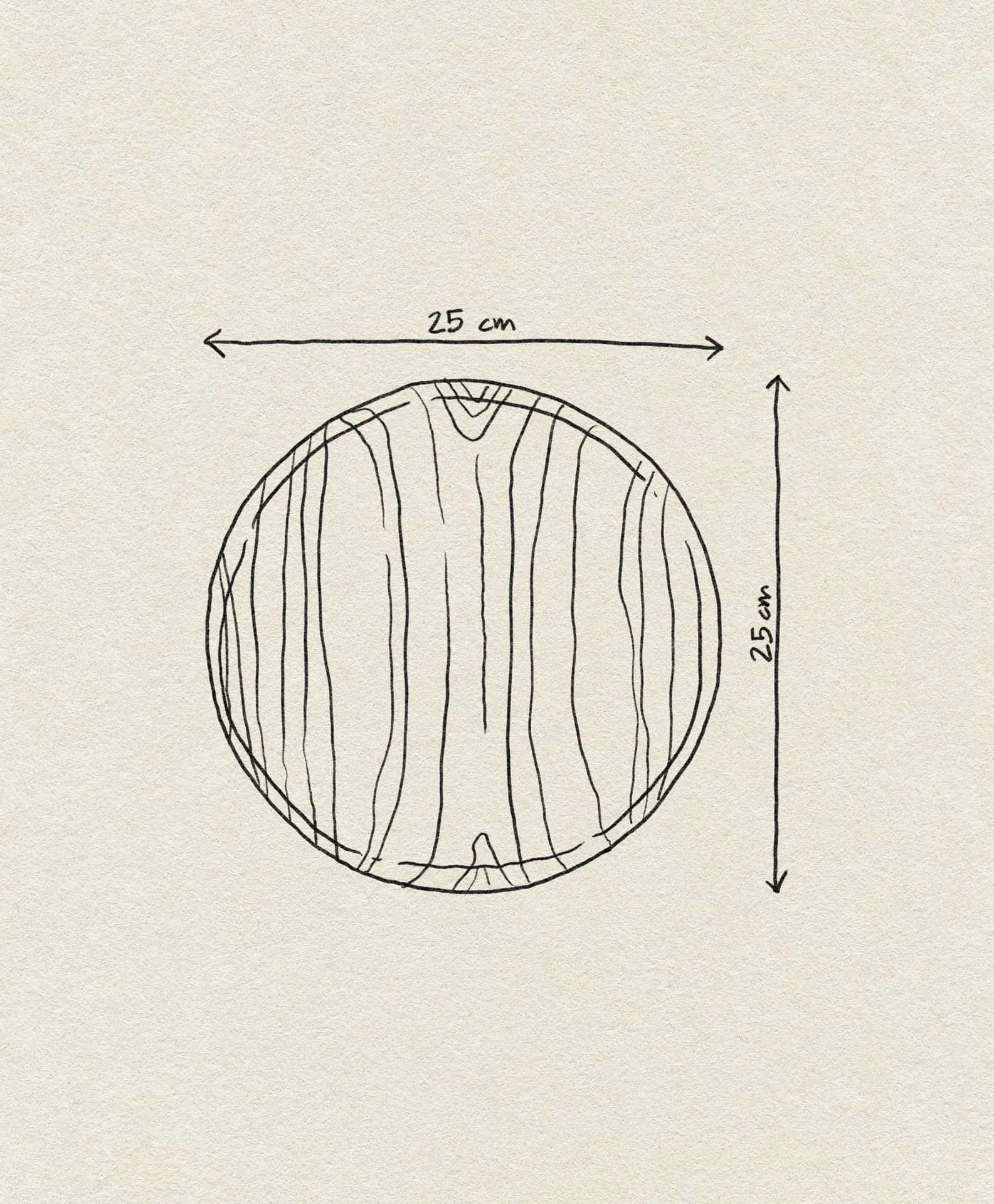 A hand-drawn illustration of the Bloomingville Nolia Plate—a 25cm wooden plate by Bloomingville with a rustic finish and visible grain, showing labeled arrows on the top and right to indicate its width and height.
