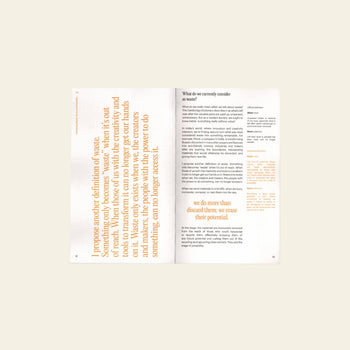 Bluetaped Refuse: A Dumpster Diving Craft Handbook by Wong Eng Geng from Bluetaped is open on a beige surface, displaying an orange upcycling quote on the left and black text with orange highlights in a clean, modern layout.