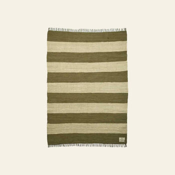 The Bongusta Chindi Rug (140x200) by Bongusta features horizontal olive green and beige stripes, fringed short sides, and a small brand tag in one corner. Handcrafted in India and shown on a neutral background.