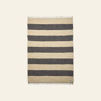 The Bongusta Chindi Rug (140x200) by Bongusta is a rectangular handcrafted rug from India with wide beige and dark gray horizontal stripes, short fringe on both ends, shown on a light background.