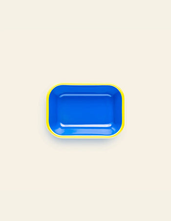 A small Bornn Enamelware Colorama baking dish with a rectangular blue enamel finish, rounded corners, and a yellow rim is shown on a plain off-white background.