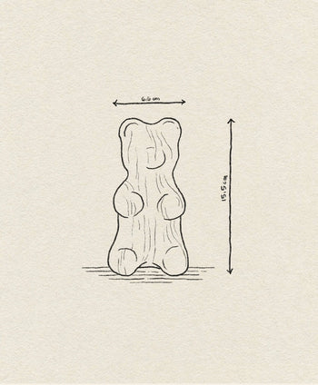 A simple line drawing of the Boyhood Gummy Bear Small by Boyhood, with arrows showing its 6.6 cm width and 15.5 cm height on a textured beige background—a sweet illustration for any candy icon collection.
