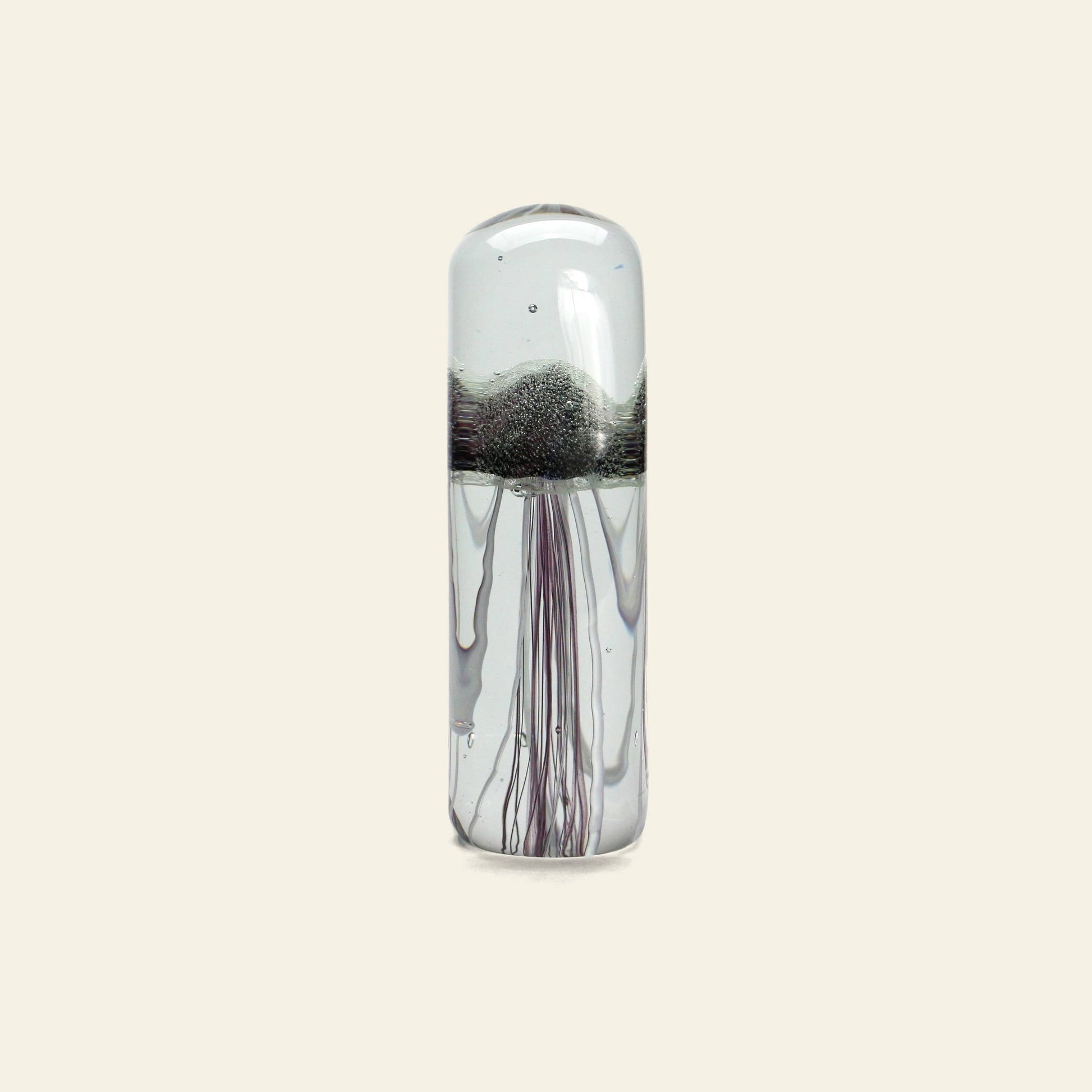 The DETAIL Jellyfish Twisted Leg Tall by DETAIL features a clear glass body, domed top, silvery center, and slender tendrils—an eye-catching modern sculpture perfect for enhancing any space.