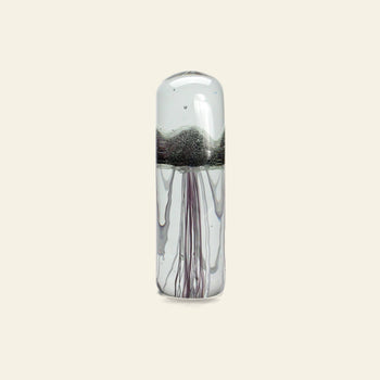 The DETAIL Jellyfish Twisted Leg Tall by DETAIL features a clear glass body, domed top, silvery center, and slender tendrils—an eye-catching modern sculpture perfect for enhancing any space.