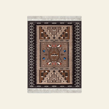 The DETAIL Mouse Rug Bessie Barber by DETAIL features a Burnham Style geometric pattern inspired by Navajo weaving, with fringe on the short edges, a central symmetrical motif of angular designs, and accented borders.