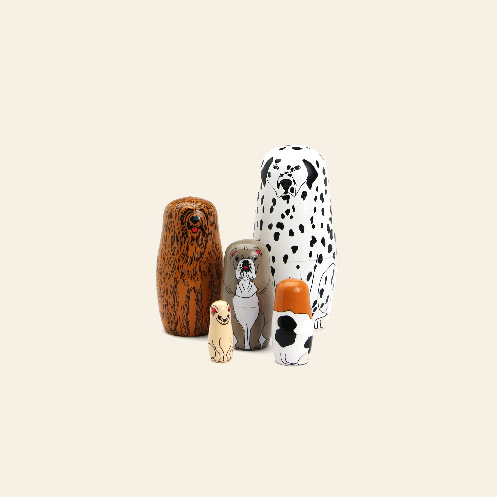 Five DETAIL Partners Nesting Dolls by DETAIL, each hand-painted to resemble a different dog breed and size, stand in a row on a plain beige background.