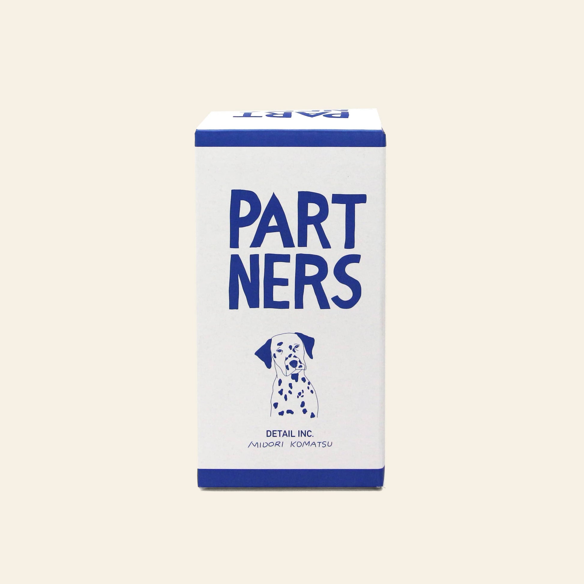 A rectangular box labeled DETAIL Partners Nesting Dolls features "PARTNERS" in large blue letters and a Dalmatian illustration below, with blue borders, a light background, and a charming dog design reminiscent of hand-painted wood.