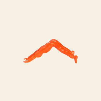 A DETAIL Yoga Joes 9 Figures orange figurine performs downward dog on a beige background—a playful DETAIL take on classic toy soldiers practicing yoga.