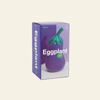 The DOIY Farmers’ Market Eggplant Utensils Pot by DOIY comes in a mostly purple box with Eggplant in bold white letters and a green BOLD sticker—perfect for kitchen essentials or adding veggie-themed flair to your decor.