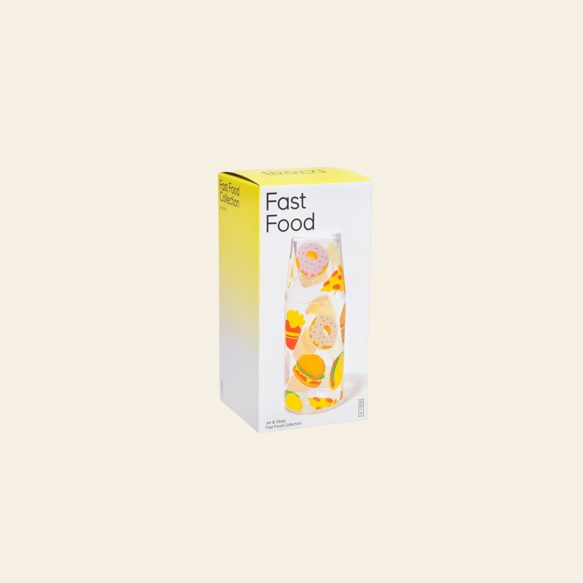 The DOIY Fast Food Jar & Glass Set from Stacked Store features a rectangular box with a yellow and white design, labeled "Fast Food" and decorated with illustrations of burgers, fries, and pizza.