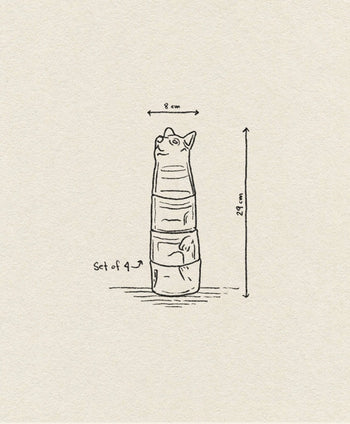 The DOIY Kitty Glasses, Set of 4 by DOIY features hand-drawn stackable cups, each displaying part of a cat’s body. When stacked, they form a cat shape. The set measures 8 cm wide and 29 cm tall.