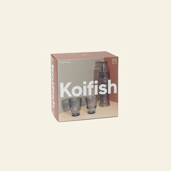 A set of four DOIY Koifish Glasses by DOIY, featuring an artistic design, is presented in a boxed set against a plain light background.
