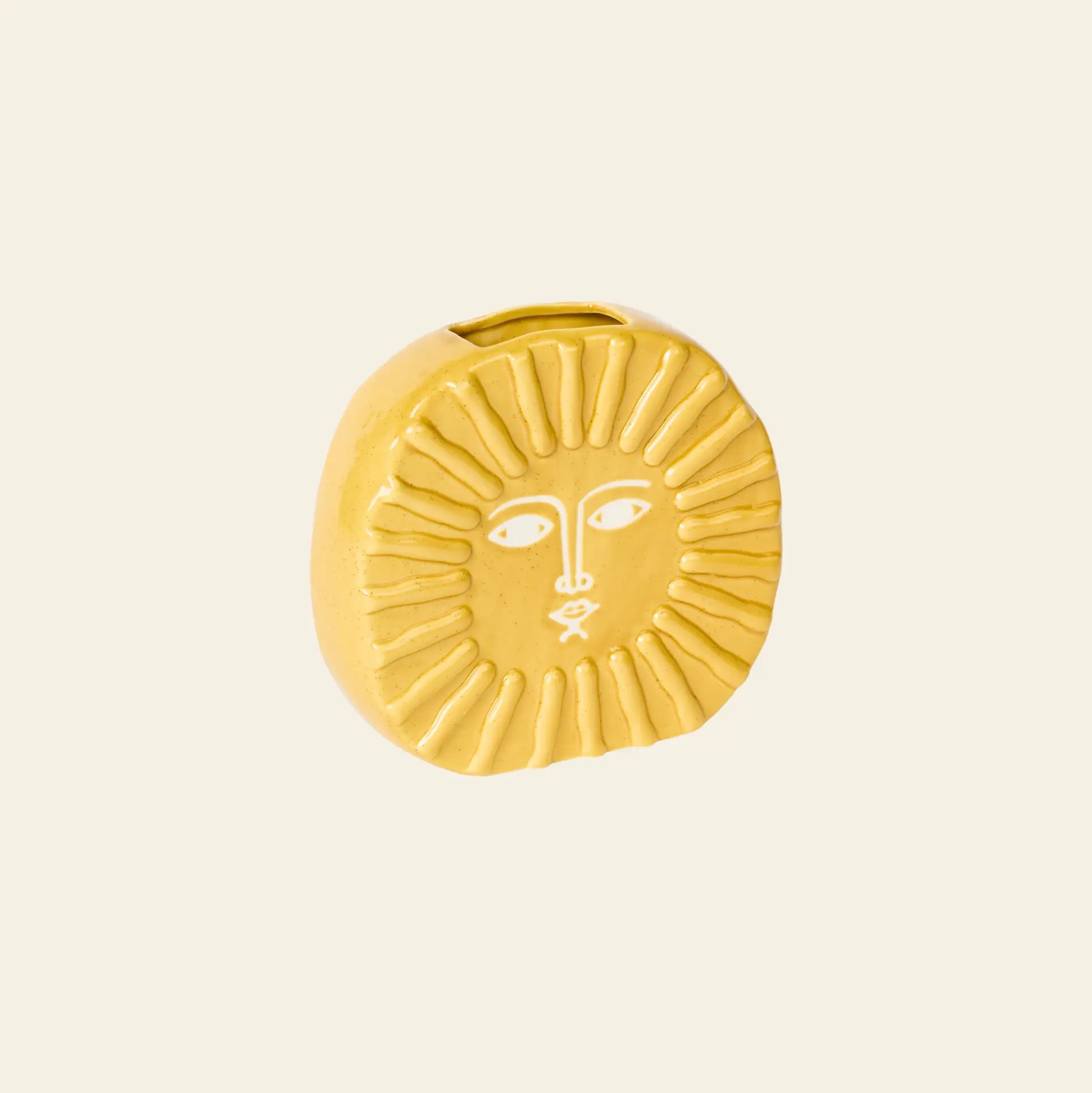 The DOIY Sun Vase by DOIY is a small, round, yellow ceramic vase with a stylized sun face featuring etched eyes, nose, mouth, and radiating sunrays—perfect for brightening your home decor.