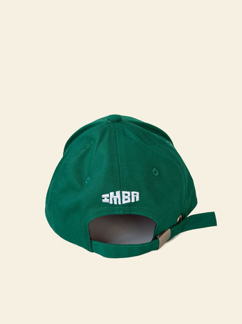 The David Hockney If You’re Not Playful Cap by David Hockney is a green cotton baseball cap displayed from the back, showcasing crisp white embroidered text and an adjustable strap with a metal buckle.