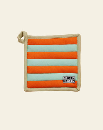 The Dusen Dusen Pocket Pot Holder by Dusen Dusen is a square, heat-resistant accessory featuring horizontal orange and light blue stripes, beige trim, a top-left loop, and a black-and-white logo patch in the bottom right corner.