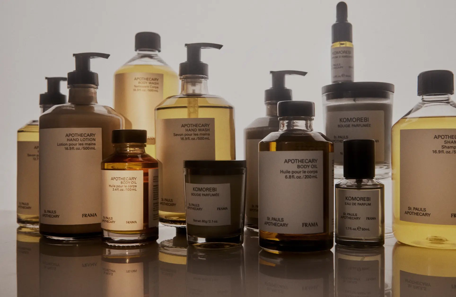 A minimalist amber glass bottle of FRAMA Body Wash, 375ml, labeled as a skincare and body product, is displayed against a neutral background.