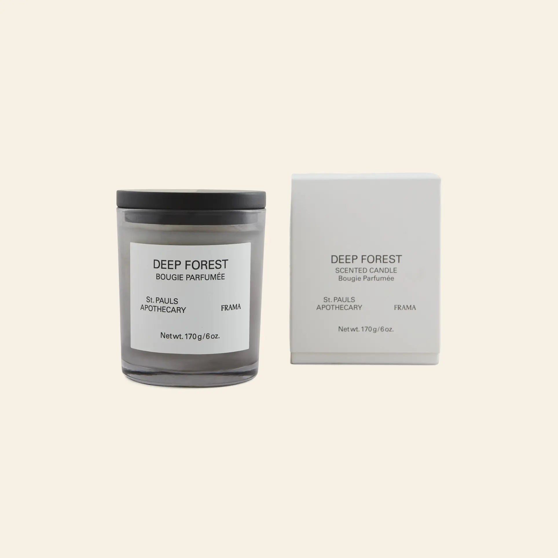 The FRAMA Deep Forest Scented Candle, 170g, with a black lid, is shown next to its matching minimalist white box—both feature black text on a clean background and evoke the earthy aroma of Abies fir woods.