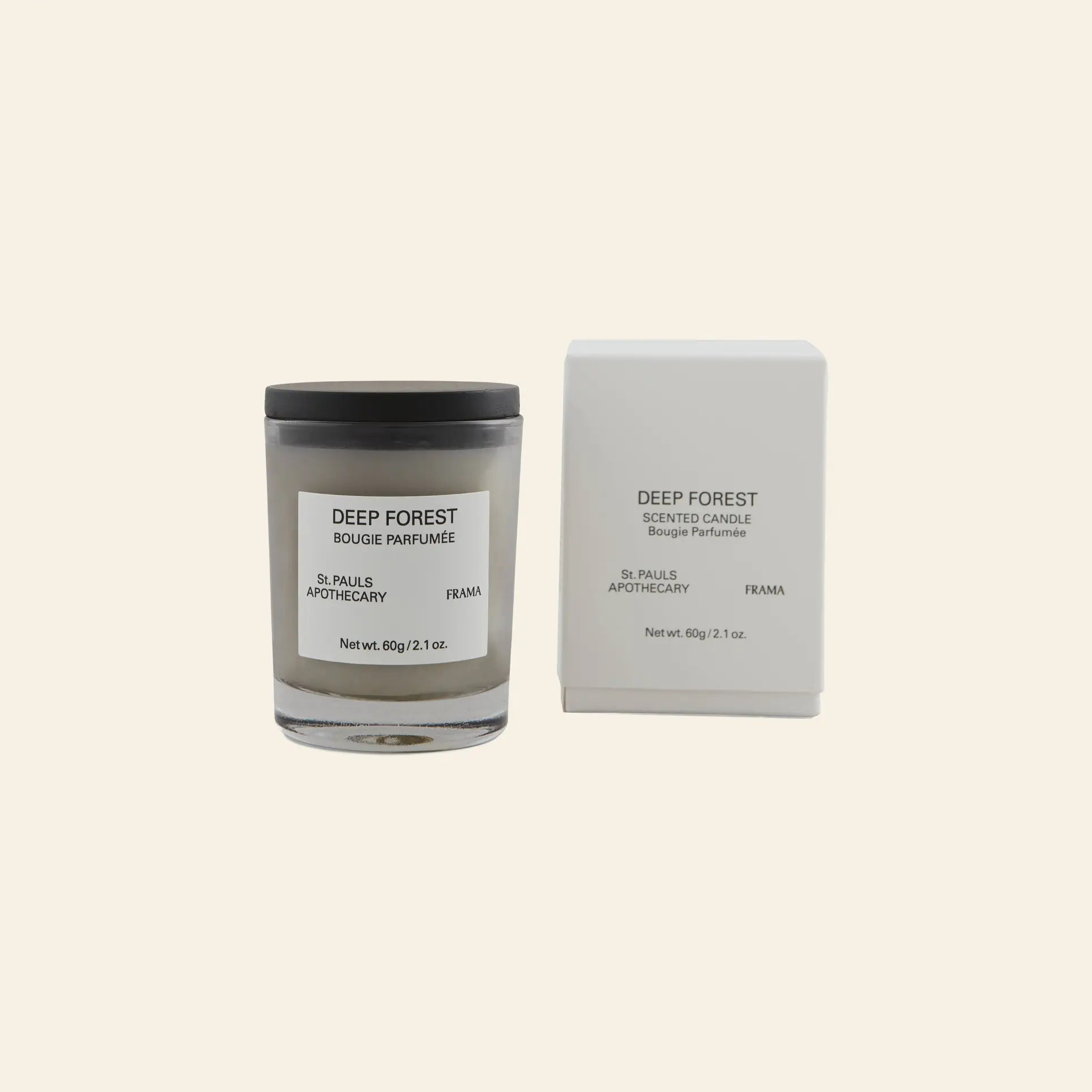 The FRAMA Deep Forest Scented Candle, 60g, inspired by Abies fir woods, is shown in a glass jar beside its matching white box, both featuring minimalist black text on a cream background.