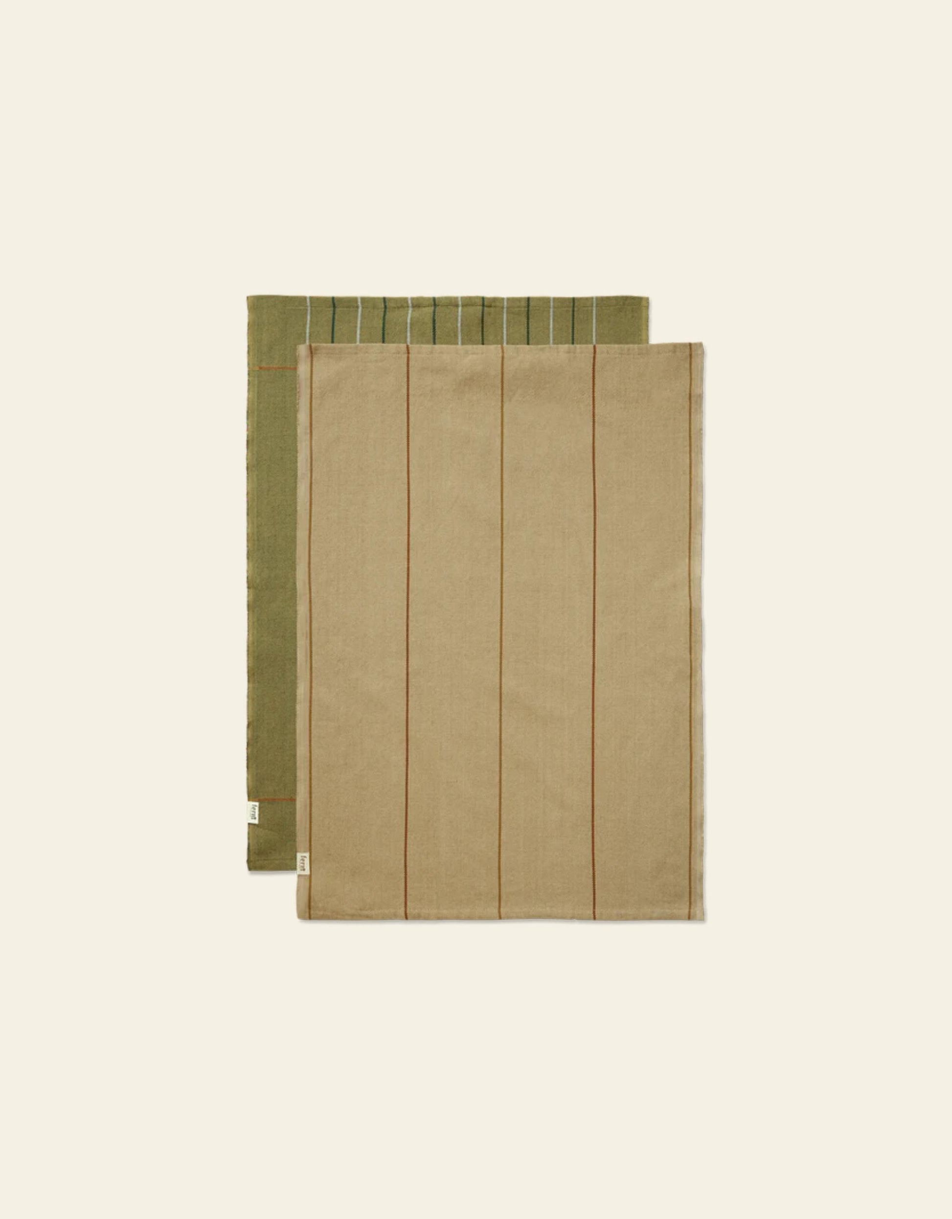 The Ferm Living Ito Tea Towel Set of 2, featuring olive green with white stripes and beige with brown stripes in a soft twill weave, is neatly folded and displayed on an off-white background.