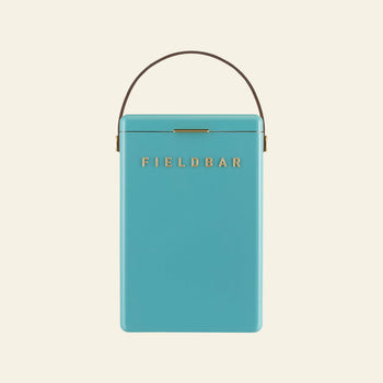 A turquoise rectangular Fieldbar Drinks Box with a brown handle and gold FIELD BAR logo on the front, shown on a beige background—crafted by Fieldbar for superior thermal performance.